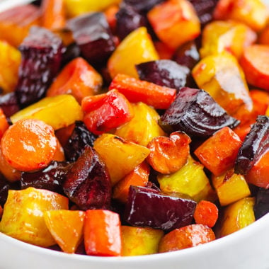 Honey Roasted Beets & Carrots in white bowl on table