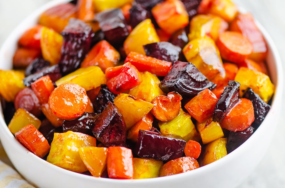 Honey Roasted Beets & Carrots in white bowl on table