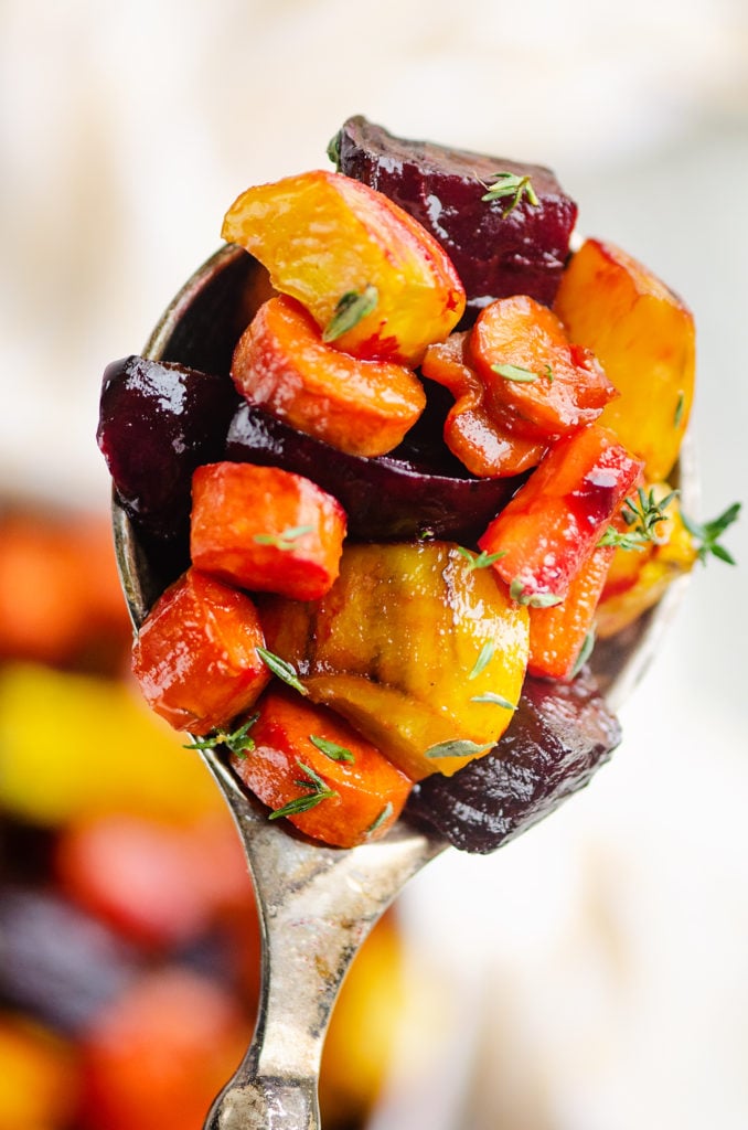 Honey Roasted Beets & Carrots in spoon with fresh thyme