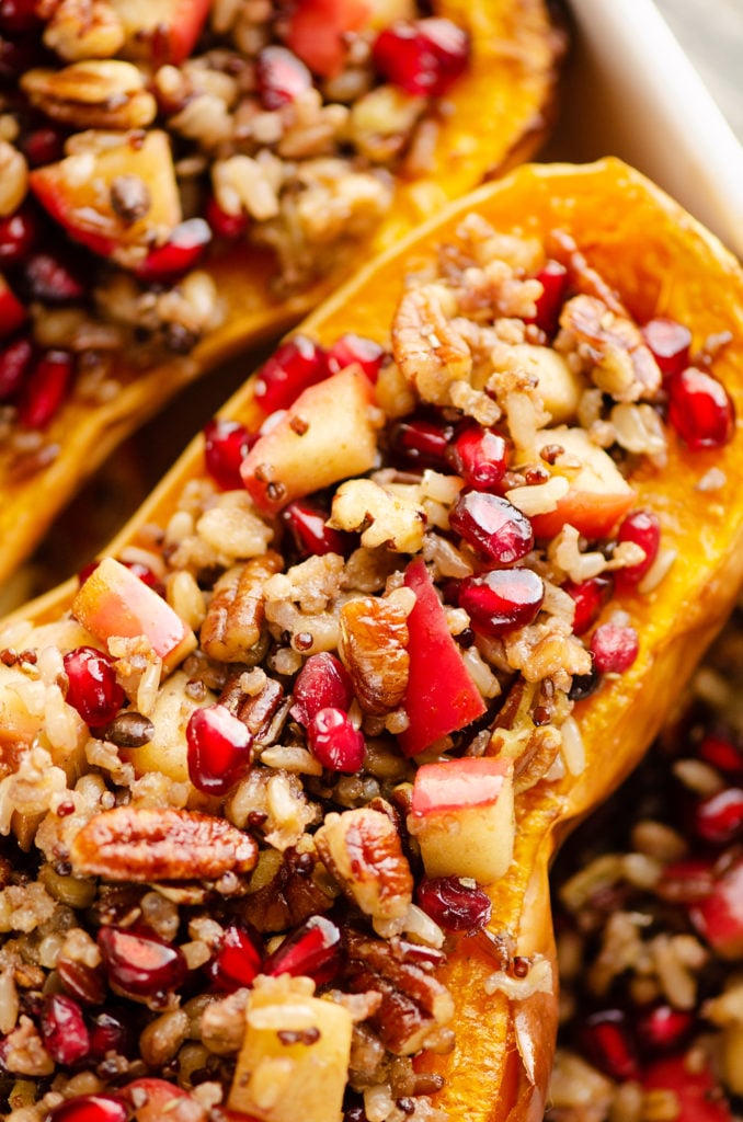 Stuffed Butternut Squash with Apples, Pomegranates & Grains in baking dish