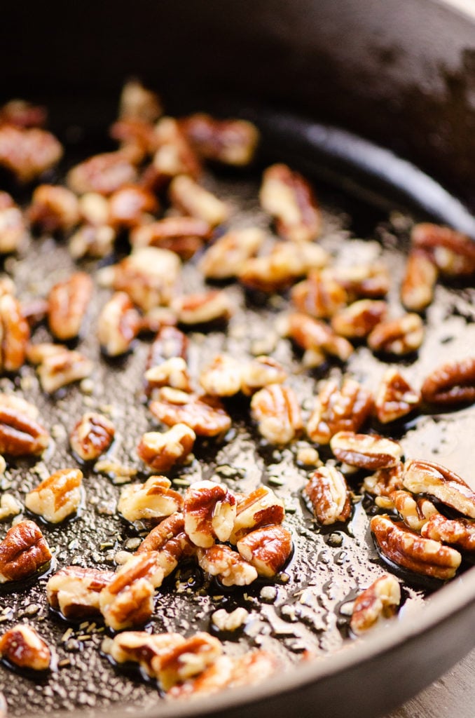 toasted pecans with olive oil in skillet