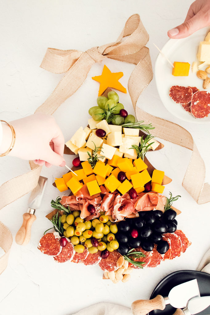 christmas tree cutting board topped with meat and cheese