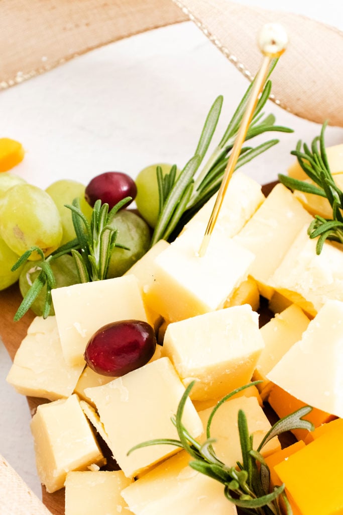 cubes of white cheese with a gold toothpick