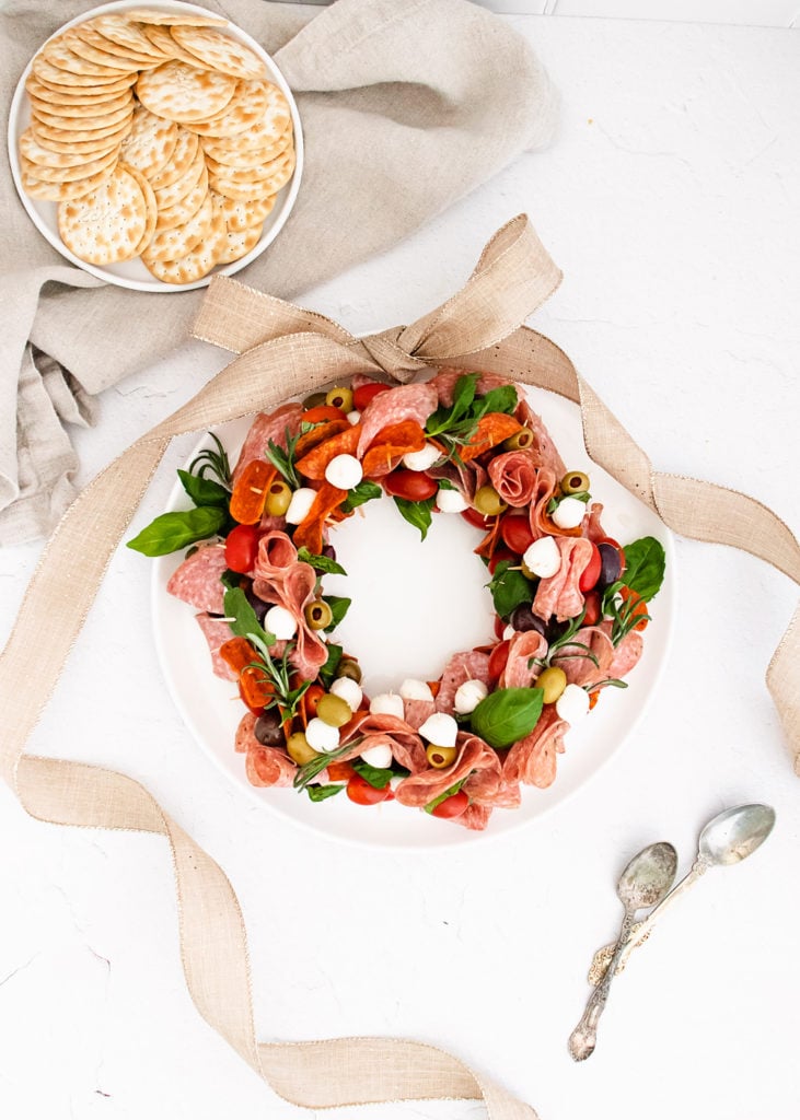 antipasto wreath on table with burlap ribbon