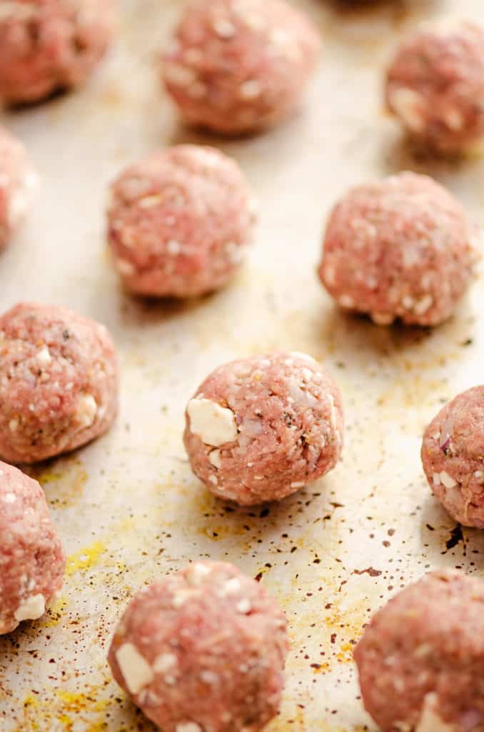 Greek feta meatballs on baking sheet