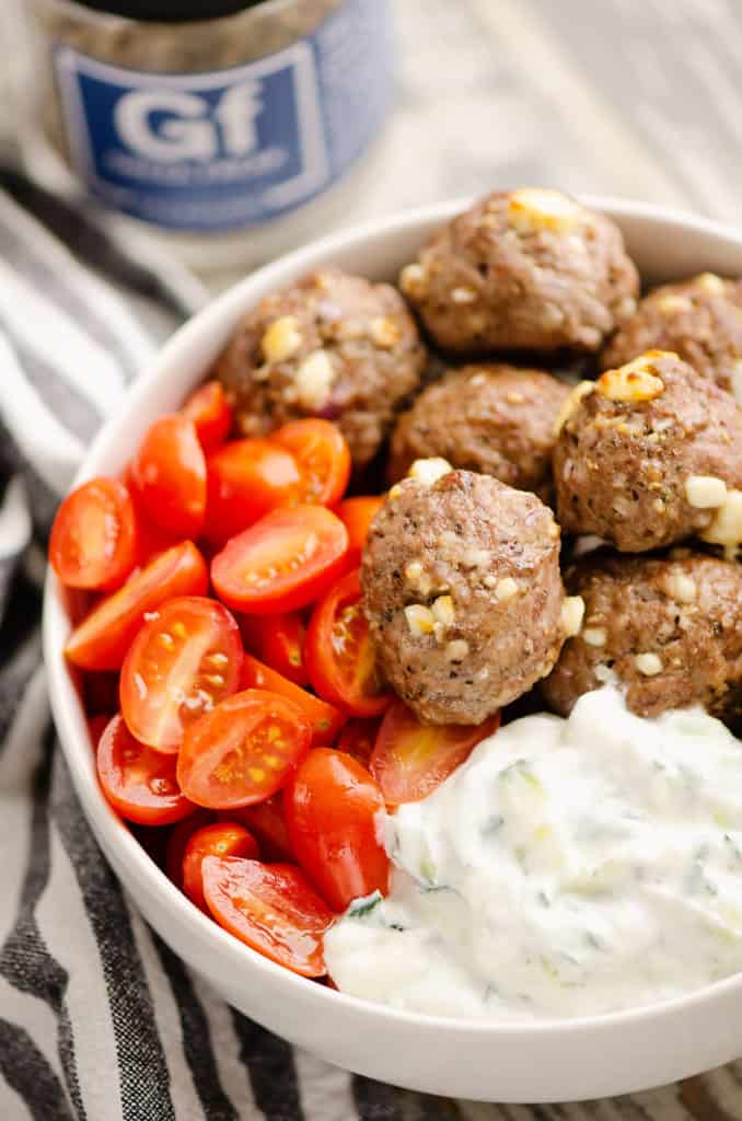 Greek meatball bowls with tomatoes and yogurt sauce