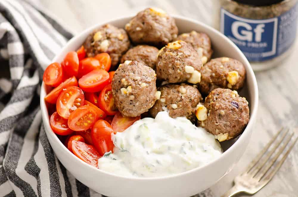 Greek meatball bowls with tomatoes and yogurt sauce