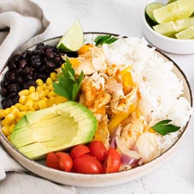 pressure cooker chicken fajita bowls on table with napkin and spoons