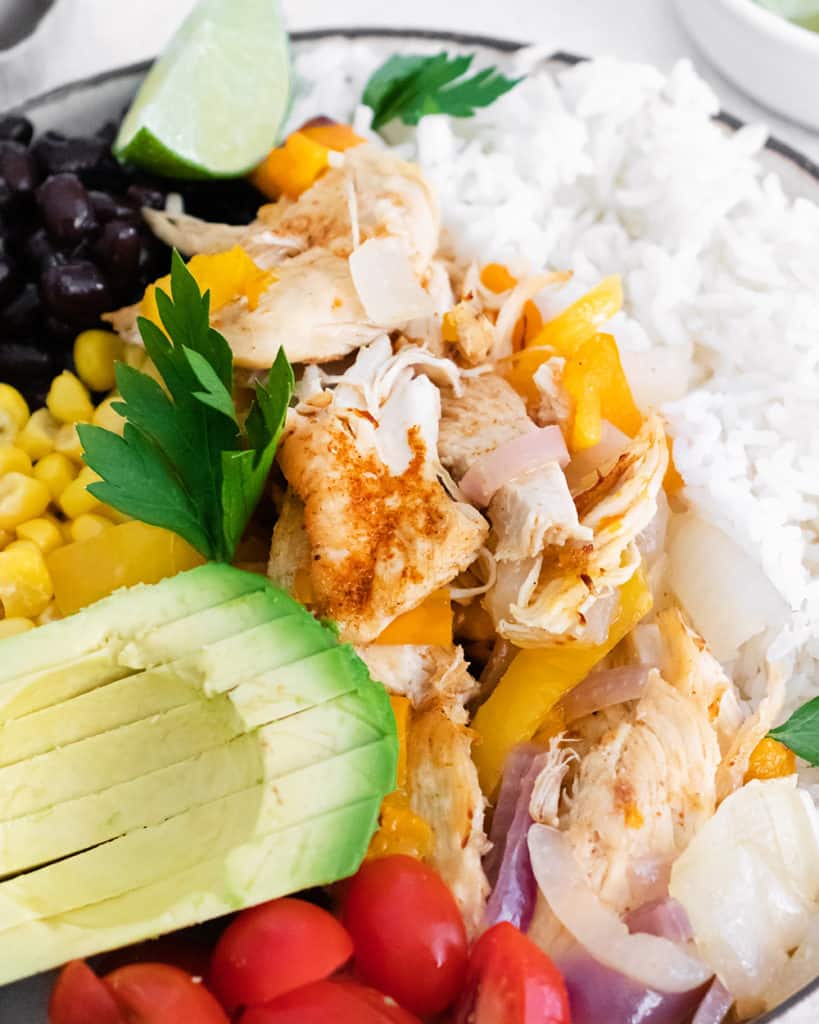 pressure cooker chicken fajita bowls made with avocado, rice, corn and black beans