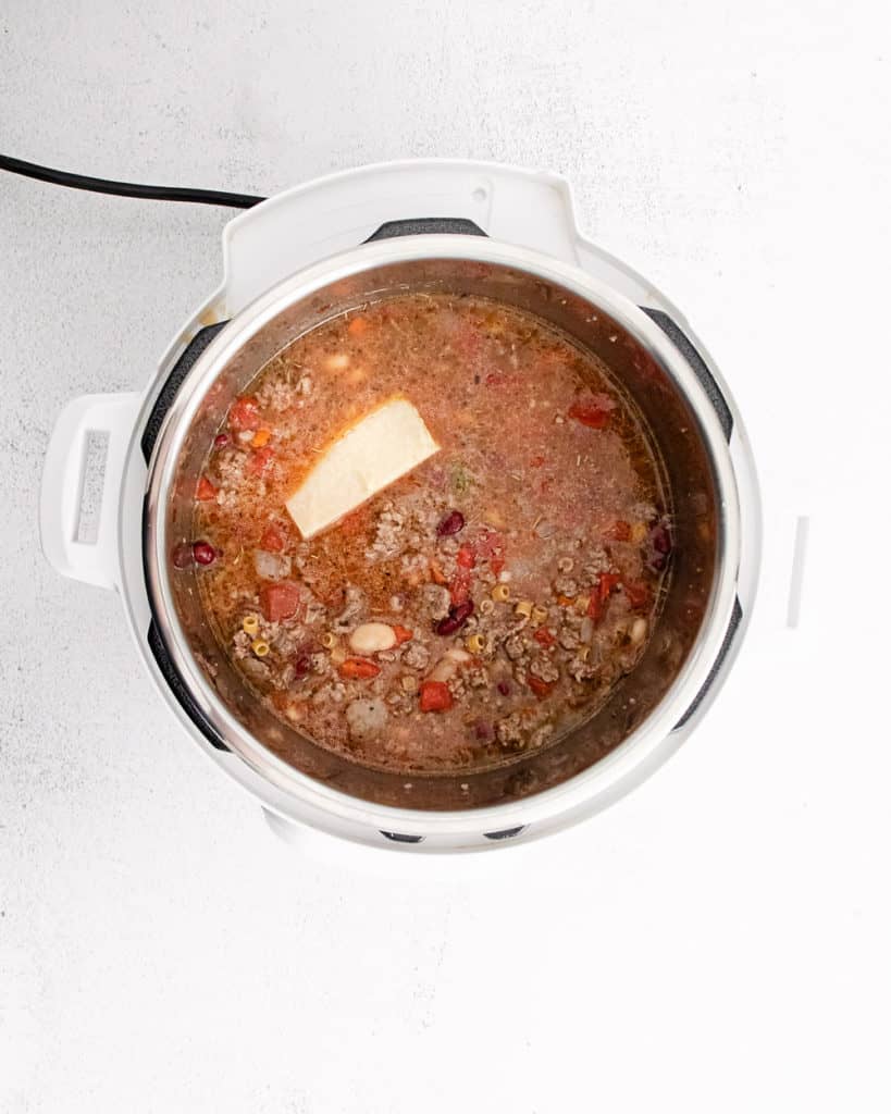 instant pot filled with beef and been soup and parmesan rind