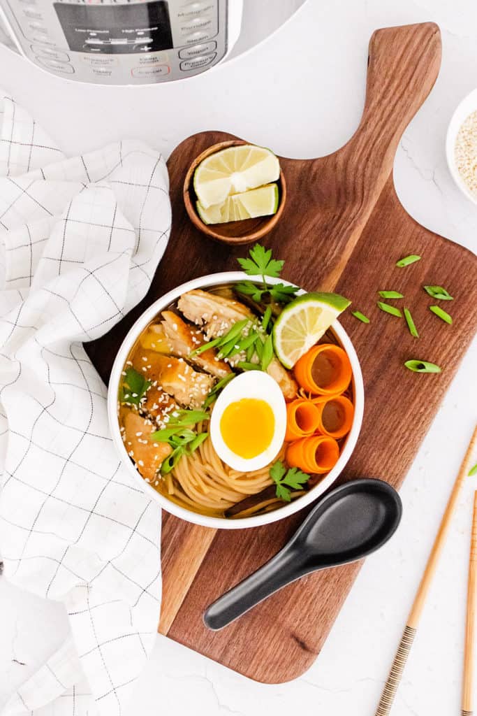 Chicken Ramen with Sweet Chili Oil in bowl on cutting board