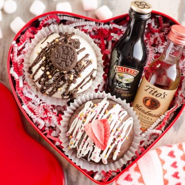 red tin heart gift box with mug, hot cocoa bombs and alcohol