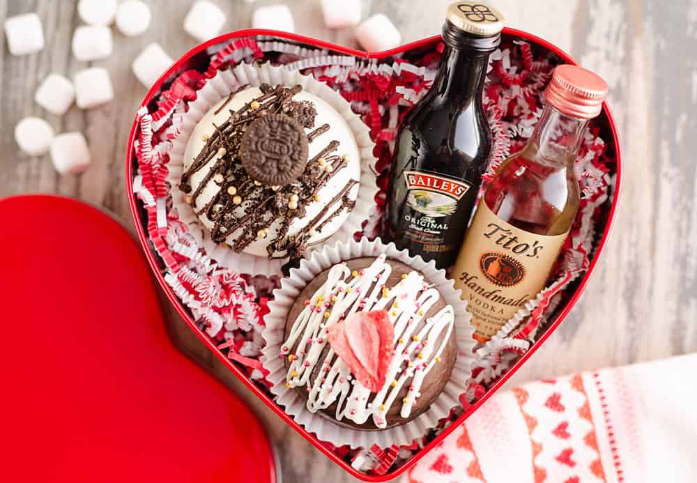 red tin heart gift box with mug, hot cocoa bombs and alcohol