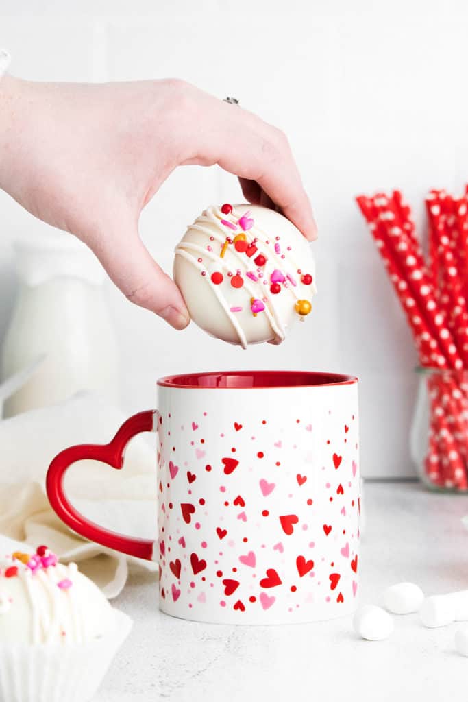 Valentine Hot cocoa bomb being added to a mug