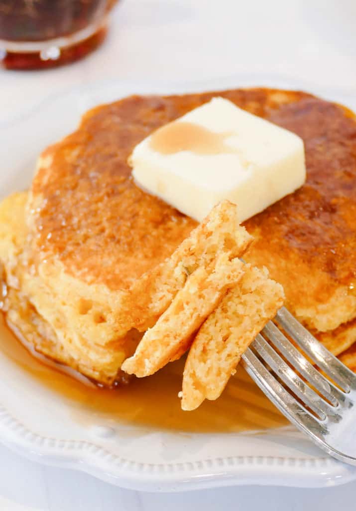 bite of cornmeal pancakes on fork