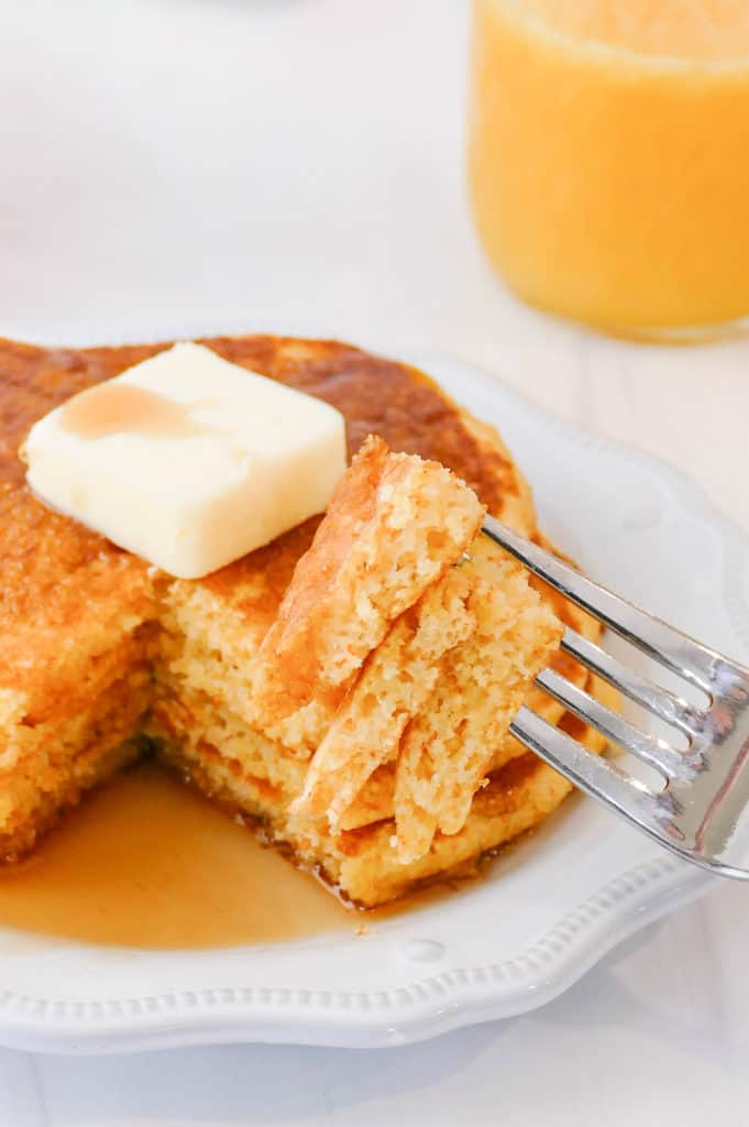 bite of cornmeal pancakes on fork