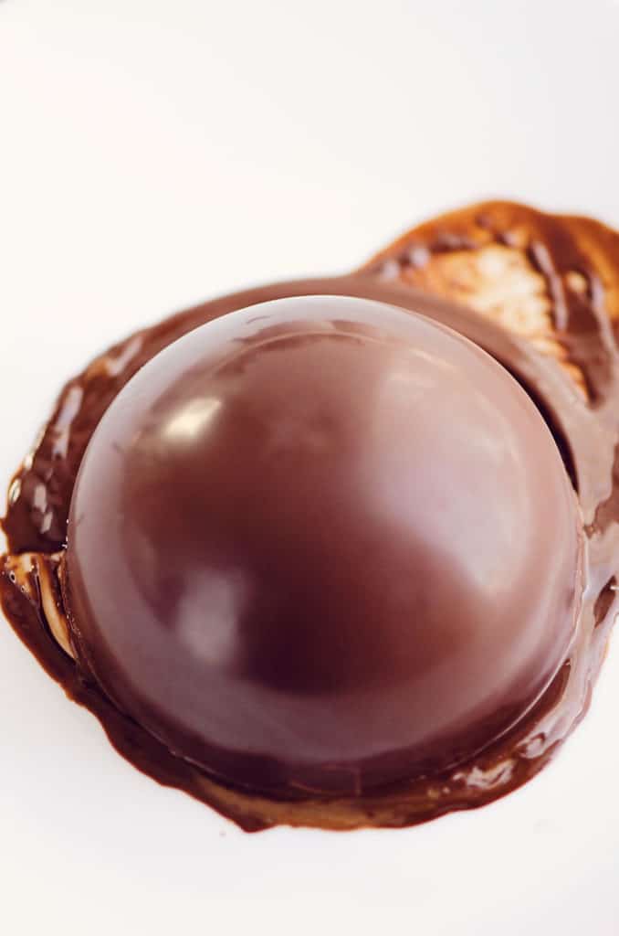 half sphere of chocolate melted on plate