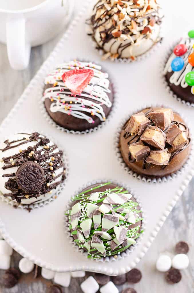 variety of hot cocoa bombs in muffin tin