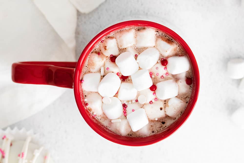 red mug with hot cocoa and marshmallows