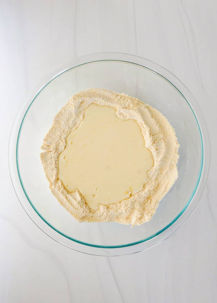 wet and dry pancake ingredients in bowl