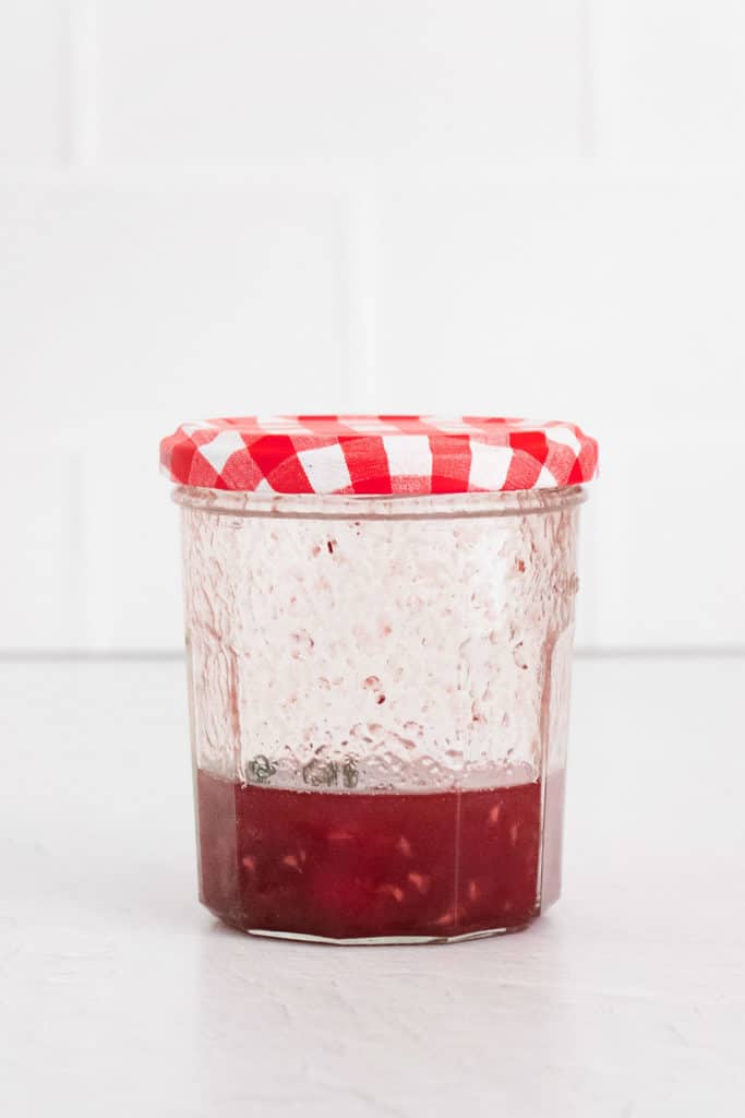 raspberry jam in glass jar