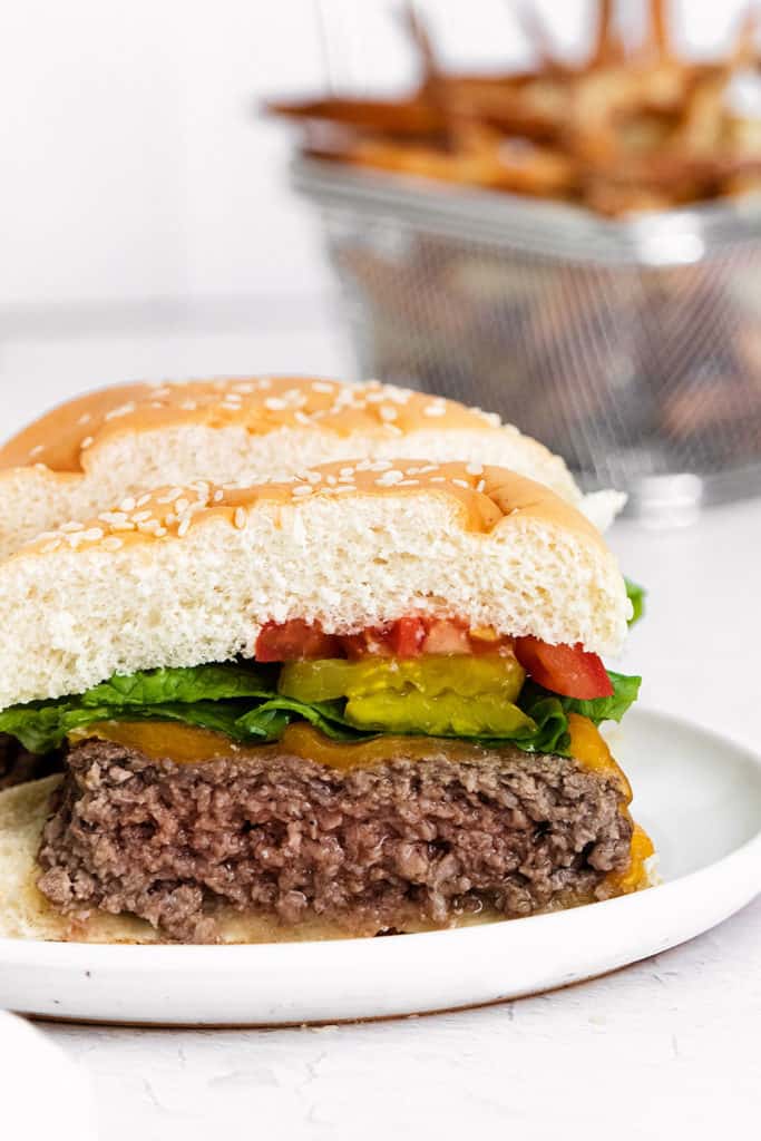 cheeseburger cut in half on plate