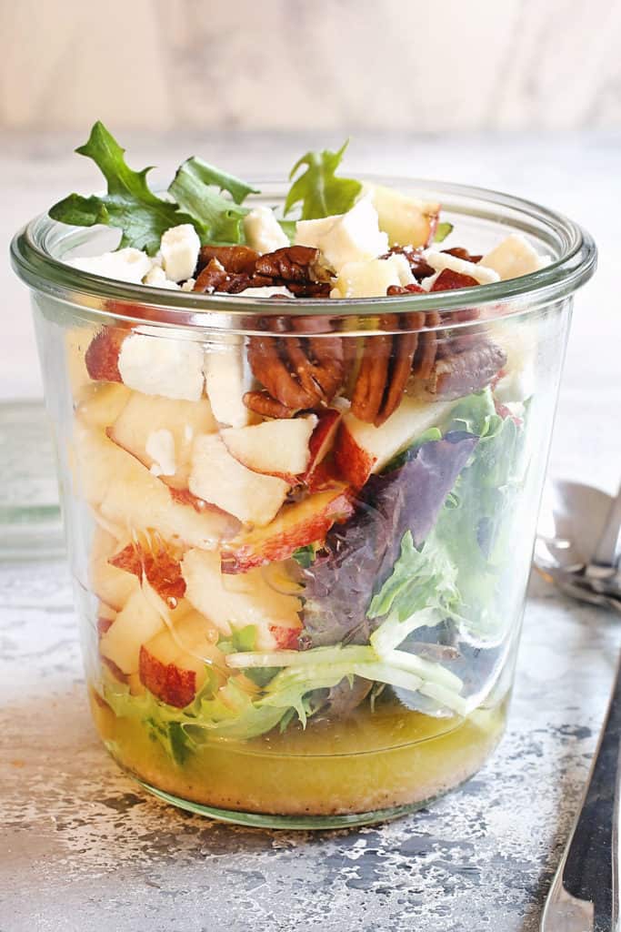 apple and candied pecans in jar