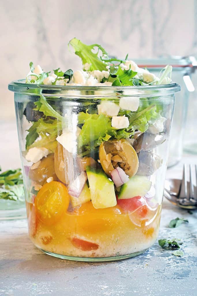 greek veggie salad in a glass jar