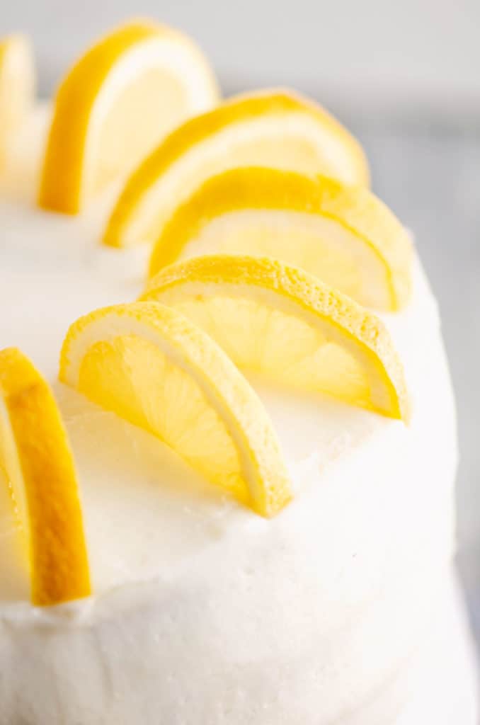 fresh slices of lemon on buttercream cake