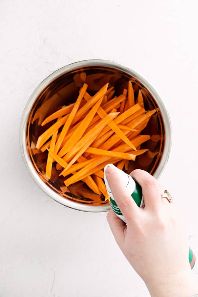 sweet potato fries in bowl with oil