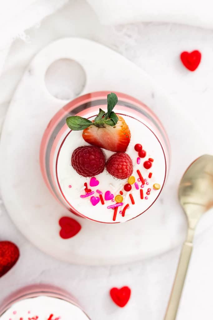 Cool Whip topping on layered jello cups with fruit