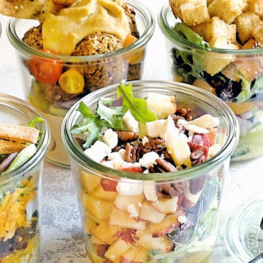 vegetable salads in a jar on table