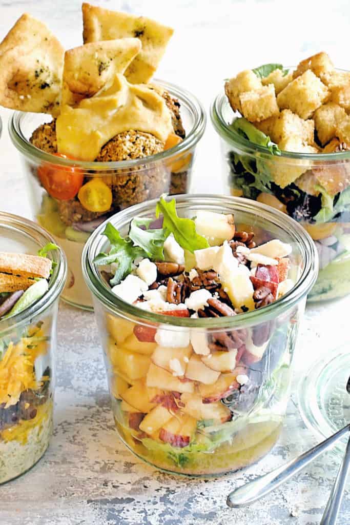 vegetable salads in a jar on table