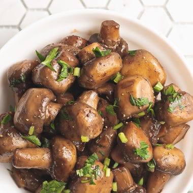 sauteed mushrooms in bowl on tile counter