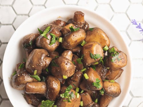 sauteed mushrooms in bowl on tile counter