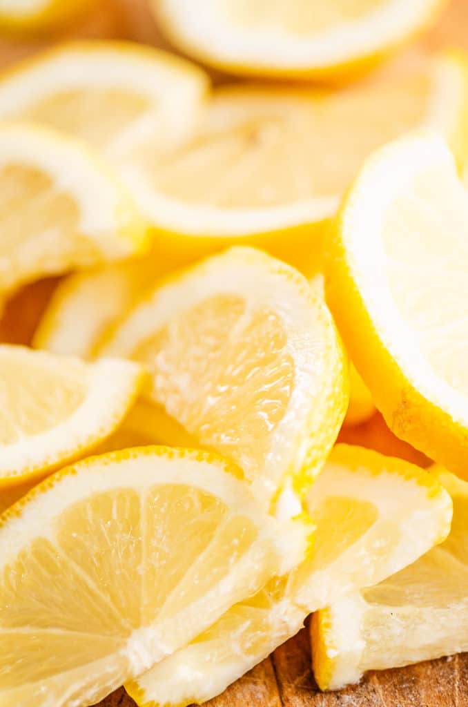 sliced lemons on cutting board