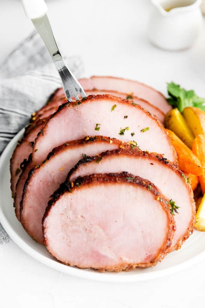 slices of air fryer ham with serving fork