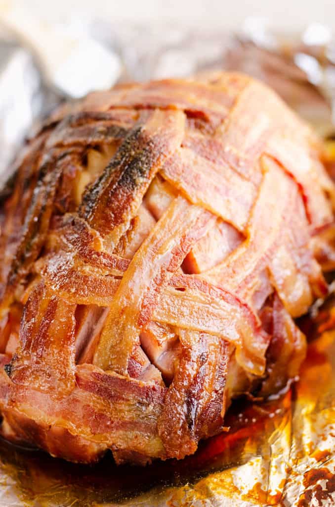 bacon wrapped ham in roasting pan