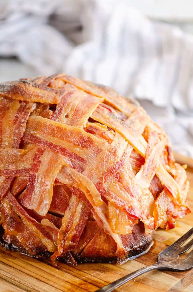 candied bacon wrapped ham on cutting board