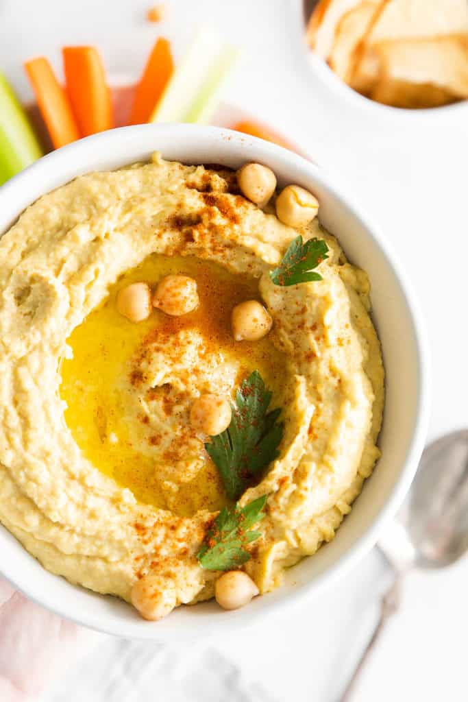 white bowl with traditional classic hummus