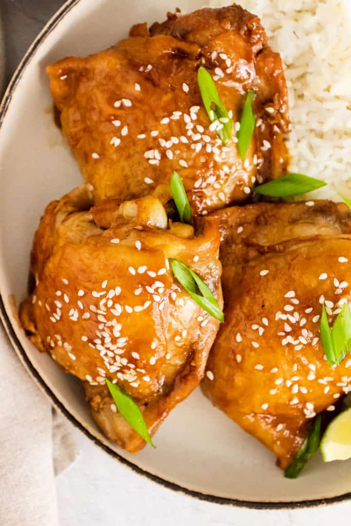 honey soy glazed chicken thighs with rice in bowl