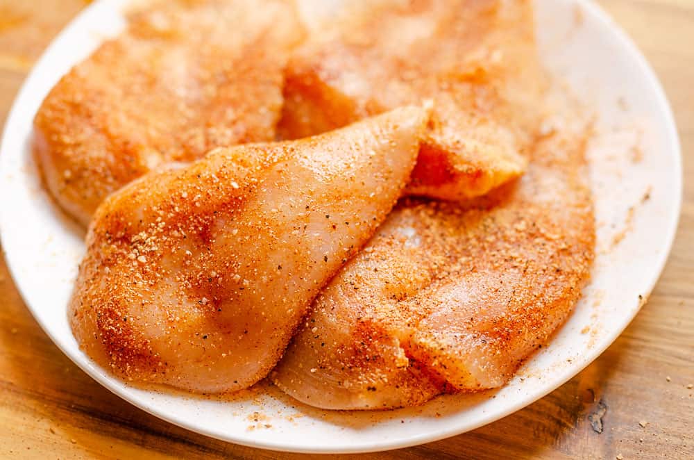 seasoned chicken breasts on white plate