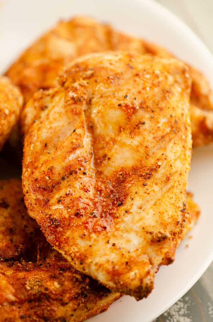 seasoned grilled chicken breasts on plate