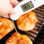 chicken breasts on grill with thermapen at 165 degrees