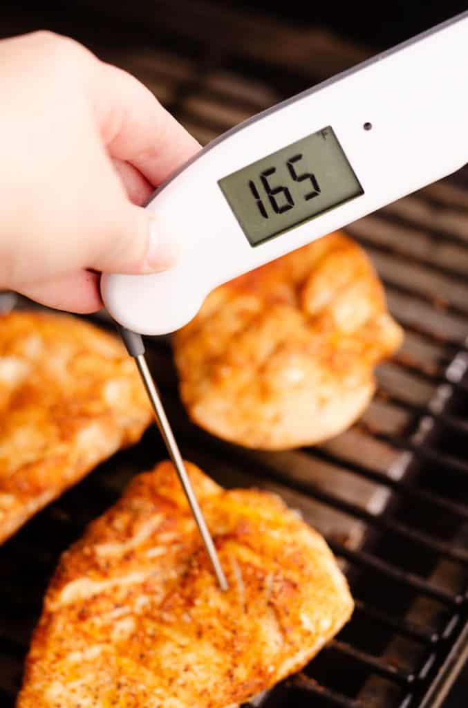 chicken breasts on grill with thermapen at 165 degrees