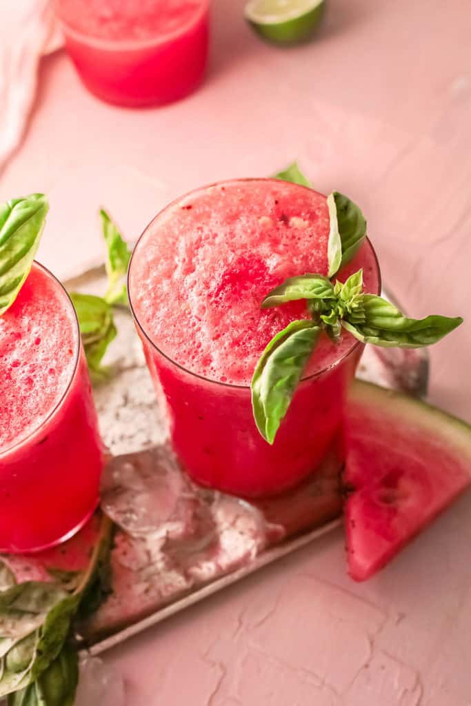 watermelon wine slushie with wedge of watermelon and ice