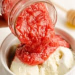 rhubarb honey sauce poured over ice cream in bowl