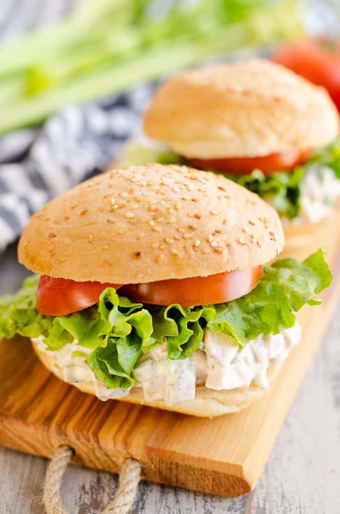 chicken salad sandwiches on wooden tray