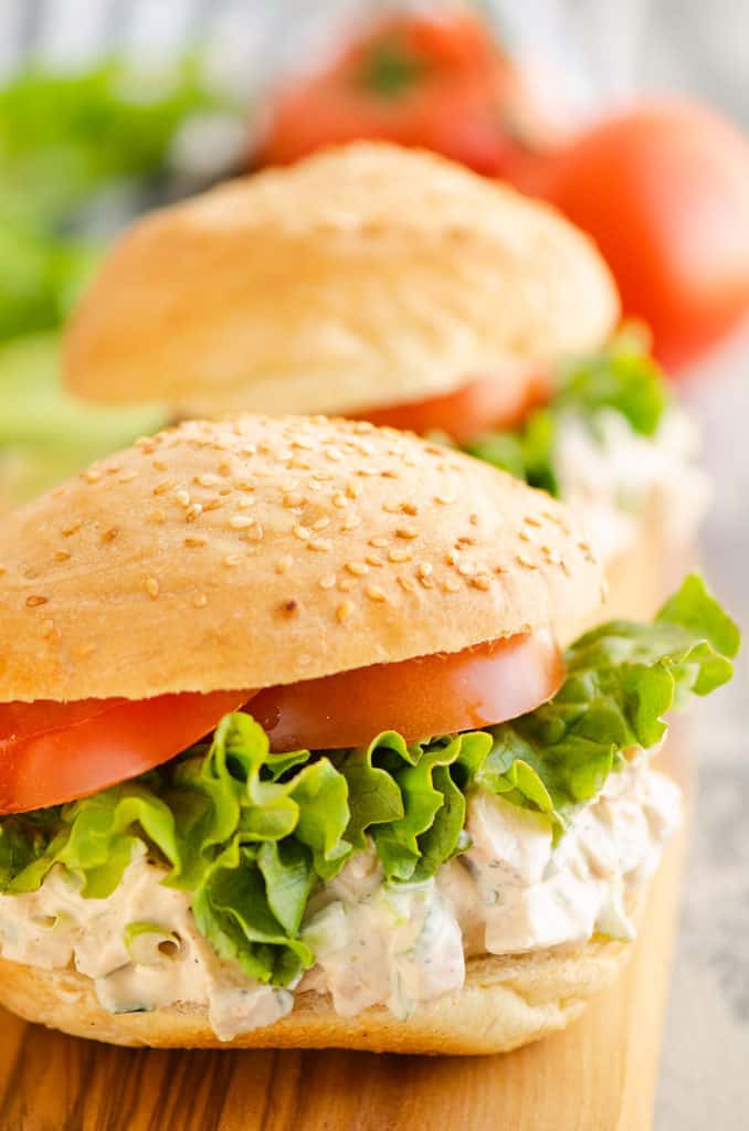 smoked chicken salad on sesame buns with lettuce and tomatop