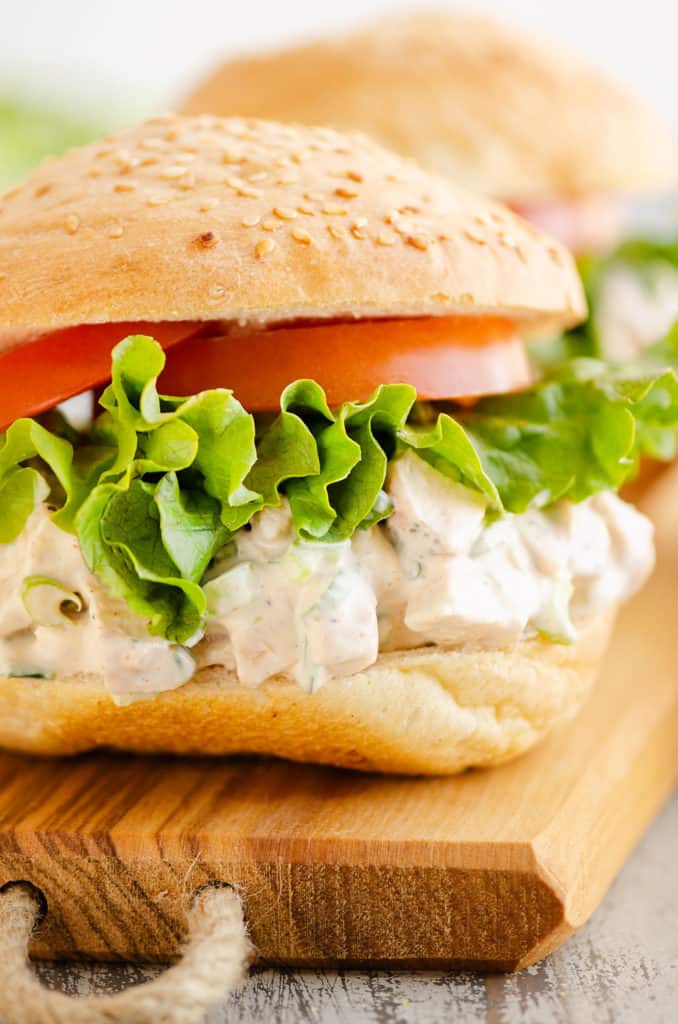 smoked chicken salad sandwich on wooden tray